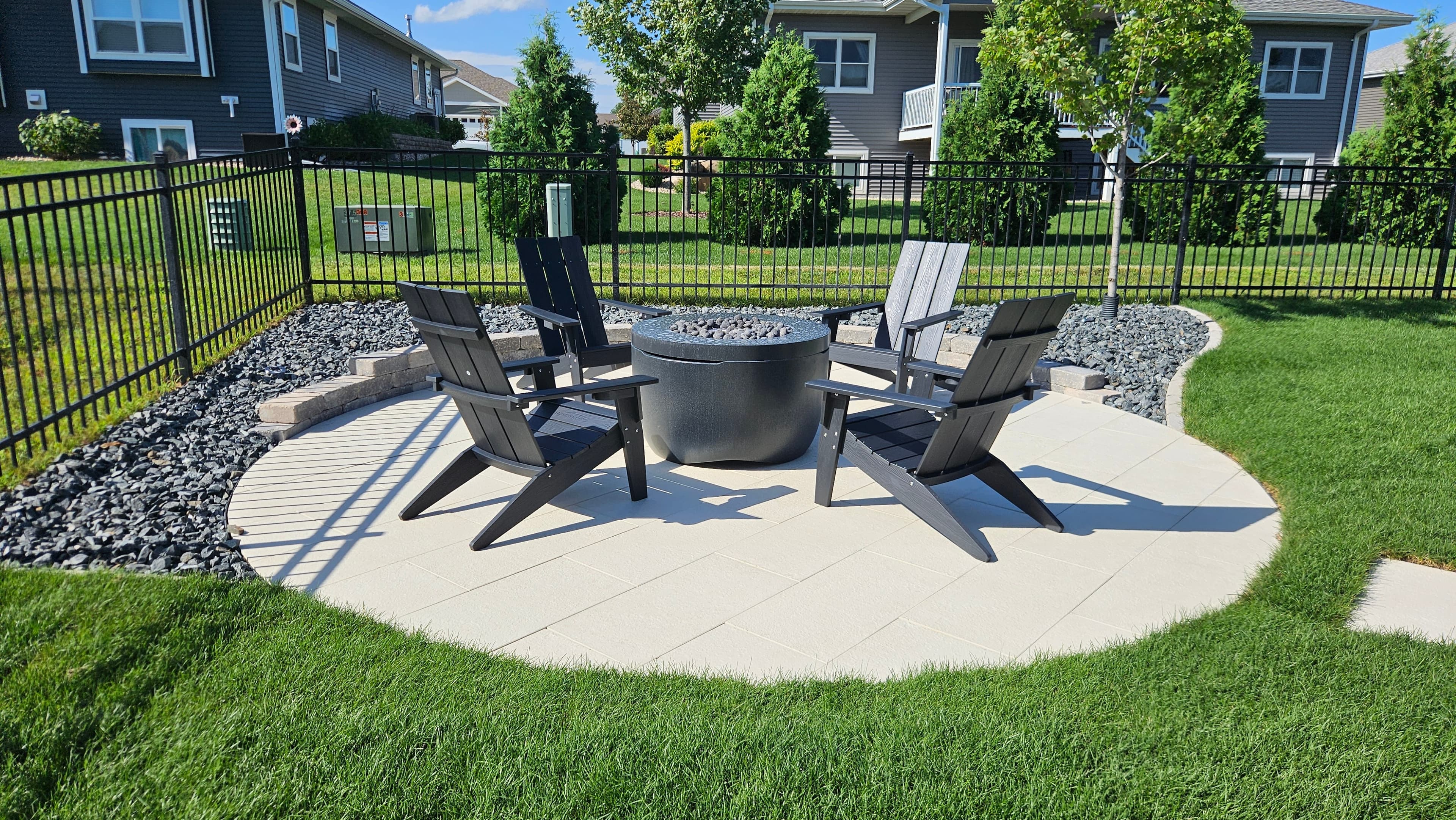 Custom flagstone stepping stone pathway and circular fire pit patio with modern outdoor living space